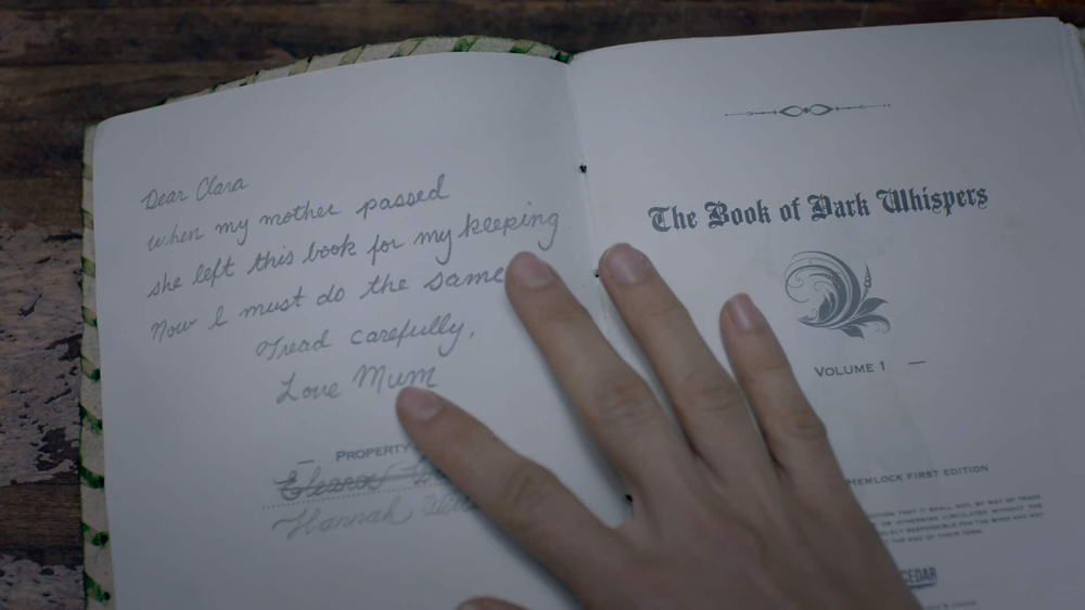 DW_Close-Up-of-The-Book-of-Dark-Whispers_Mothers-Inscription_2021_01.jpg